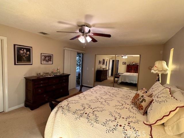 bedroom with ceiling fan, carpet flooring, and access to outside