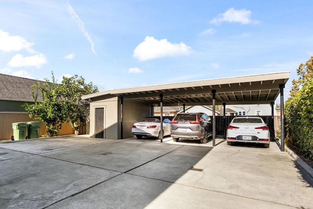 view of parking / parking lot featuring a carport