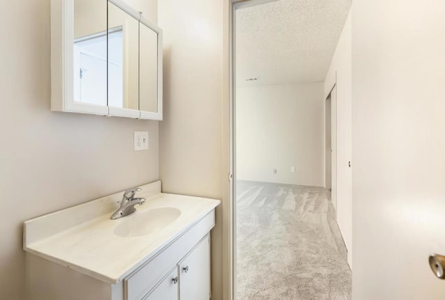 bathroom featuring vanity and a textured ceiling