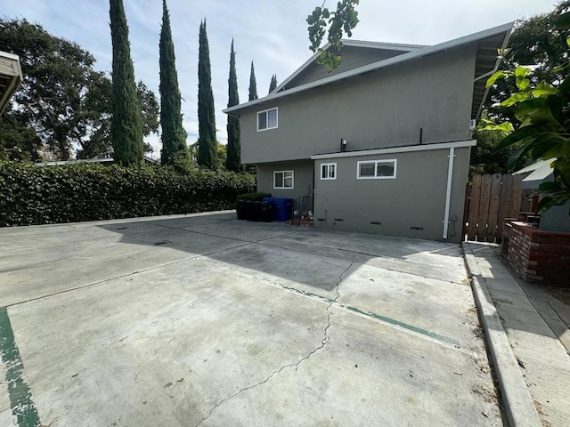 rear view of property featuring a patio area