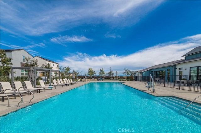 view of swimming pool with a patio