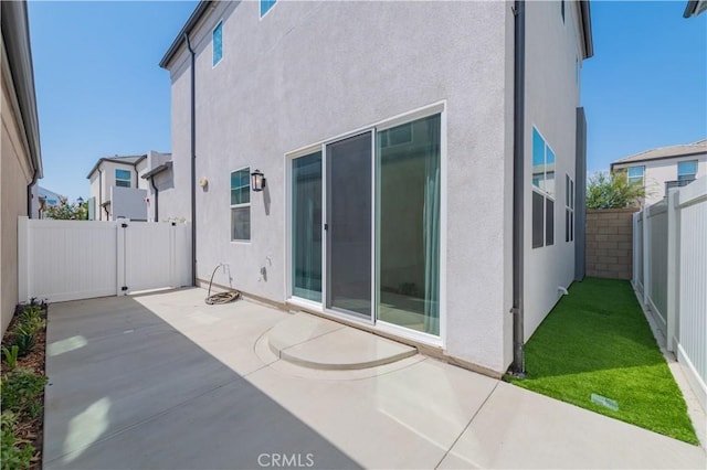 rear view of house with a patio area