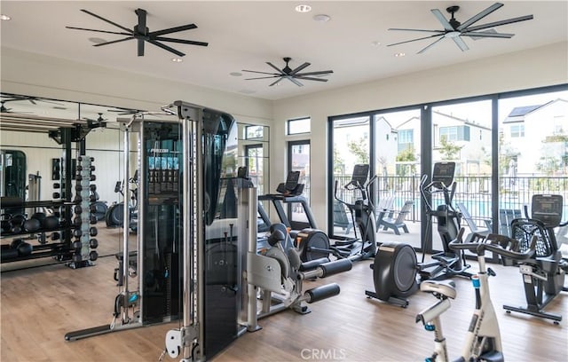 gym with light hardwood / wood-style floors