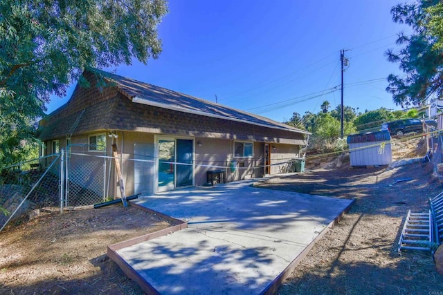 rear view of property featuring a patio area