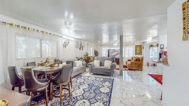 dining area featuring a healthy amount of sunlight and ceiling fan