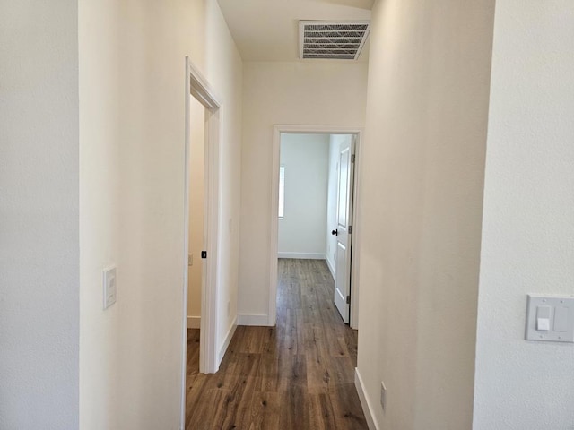 hall with dark hardwood / wood-style flooring