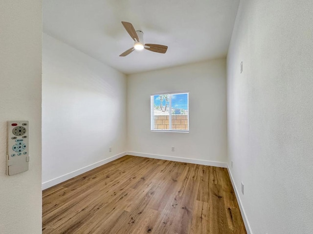 spare room with ceiling fan and light hardwood / wood-style flooring