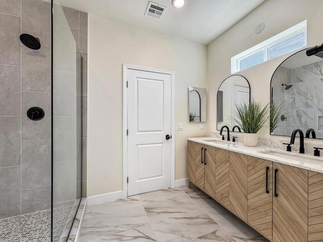 bathroom with vanity and tiled shower