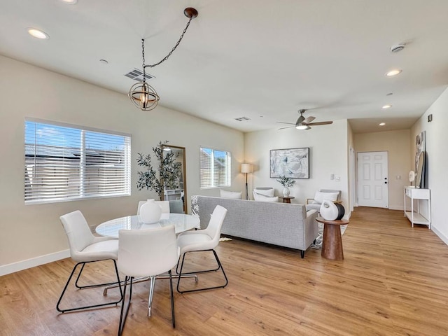 dining room featuring ceiling fan and light hardwood / wood-style floors