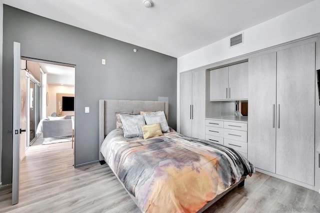 bedroom featuring a closet and light wood-type flooring