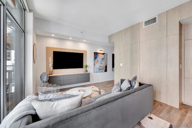 living room with light hardwood / wood-style flooring