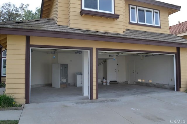 garage featuring driveway