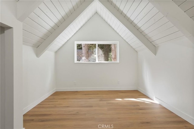 bonus room with hardwood / wood-style flooring, vaulted ceiling with beams, and wood ceiling