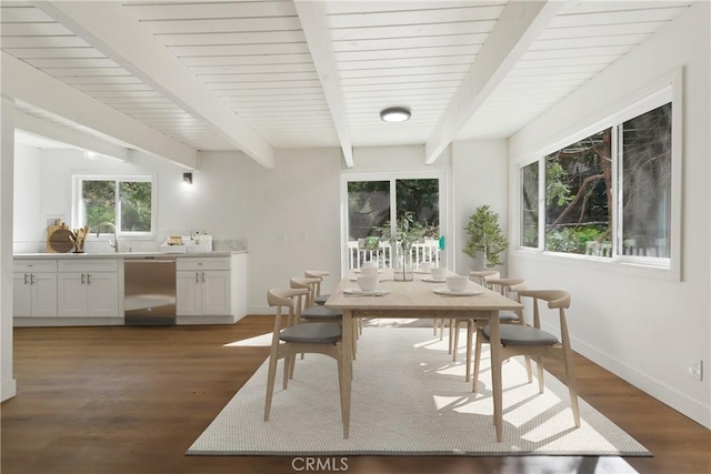 interior space with beam ceiling and dark wood-type flooring