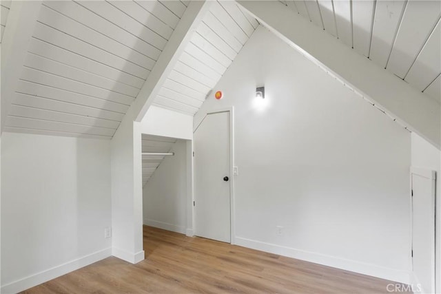 additional living space with wooden ceiling, light hardwood / wood-style floors, and vaulted ceiling