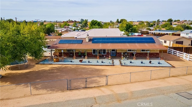 view of front of house featuring solar panels