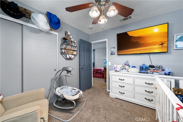 carpeted bedroom with ceiling fan