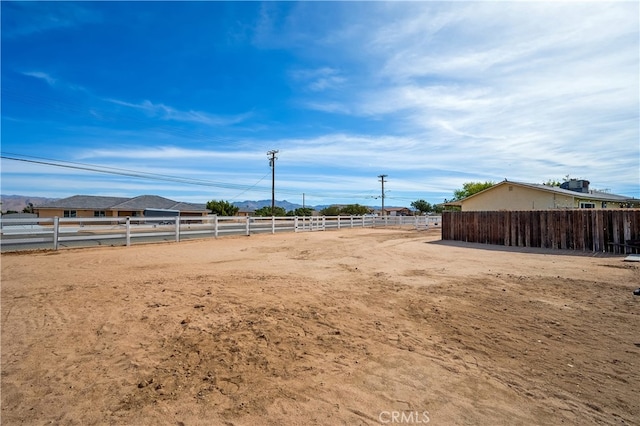 view of yard with a rural view