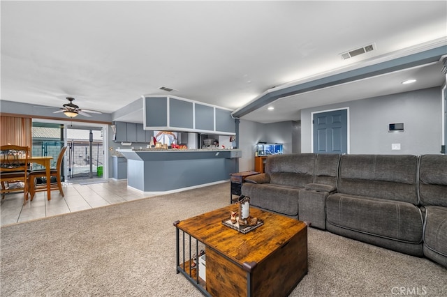 carpeted living room featuring ceiling fan