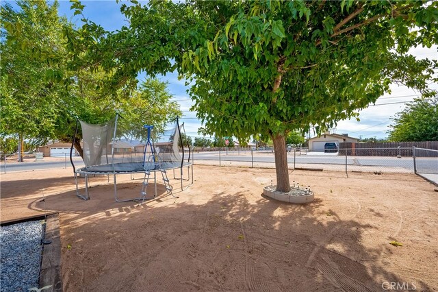 view of yard with a trampoline