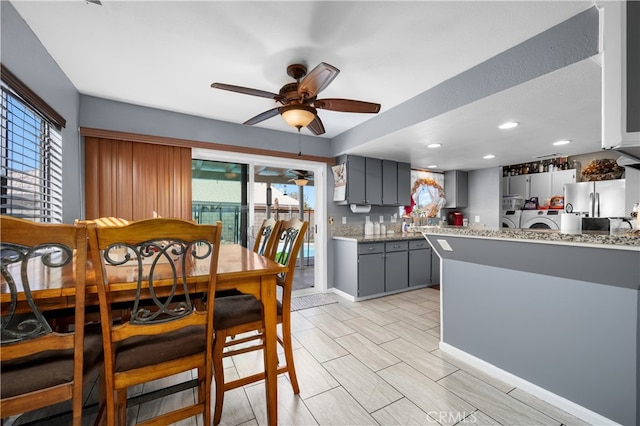 dining area with washing machine and dryer and ceiling fan