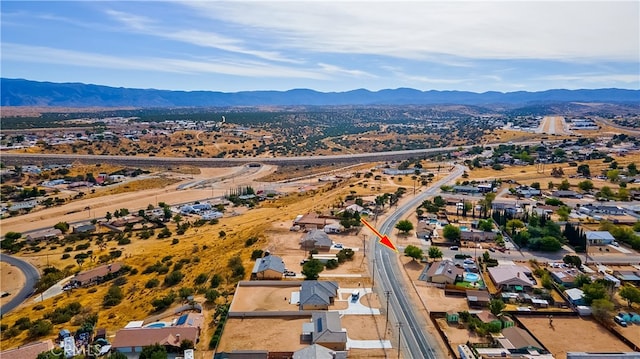 drone / aerial view featuring a mountain view