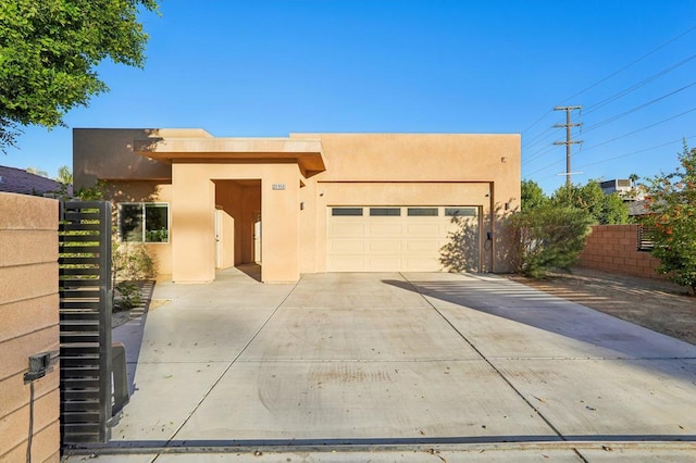 southwest-style home with a garage