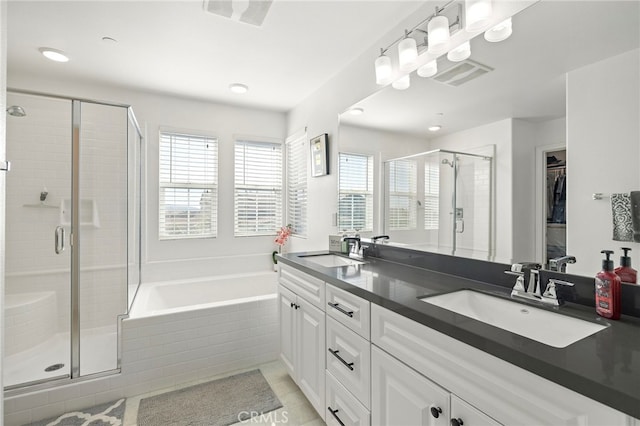 bathroom with vanity, separate shower and tub, and tile patterned flooring