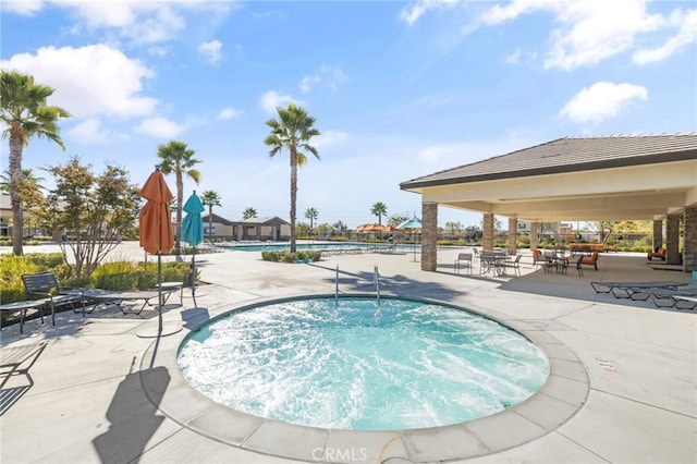 view of swimming pool with a patio area