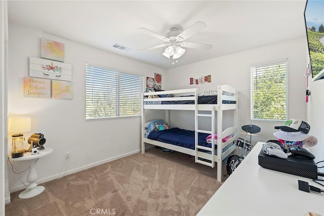 carpeted bedroom featuring ceiling fan