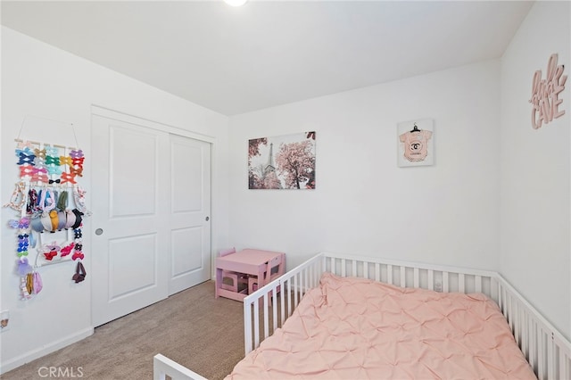 carpeted bedroom with a closet