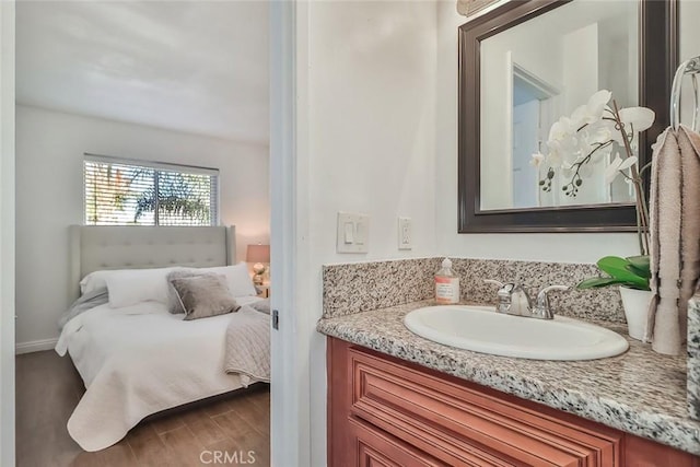 bathroom featuring vanity and wood-type flooring