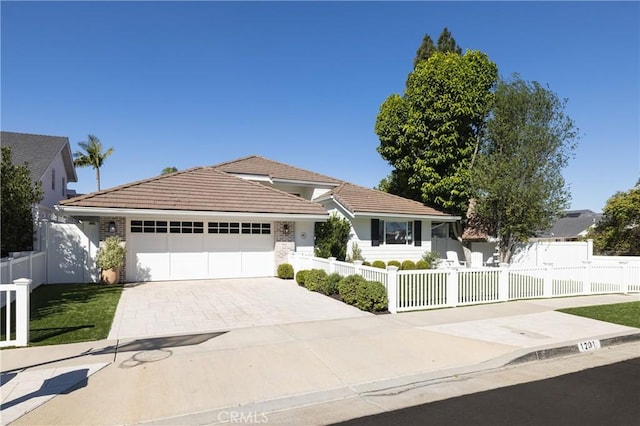 ranch-style home featuring a garage