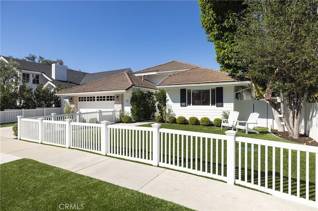 single story home with a garage and a front lawn