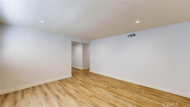 unfurnished room with light hardwood / wood-style flooring