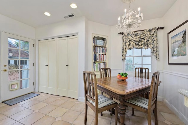 dining area with a notable chandelier