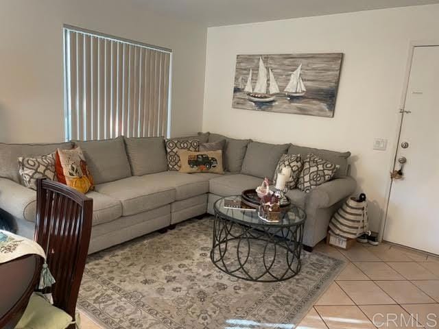 living room with light tile patterned floors