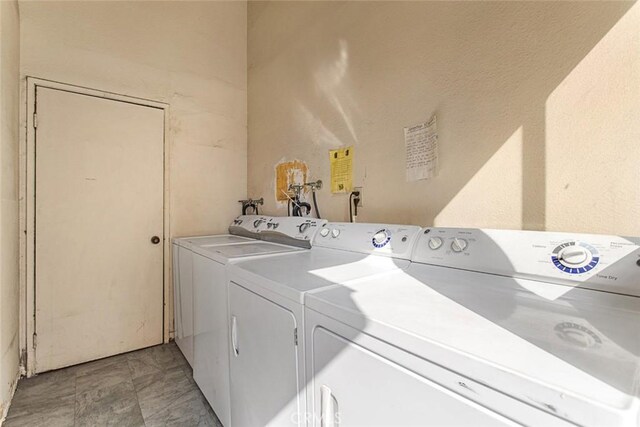 clothes washing area featuring washing machine and clothes dryer