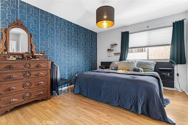 bedroom with light wood-type flooring