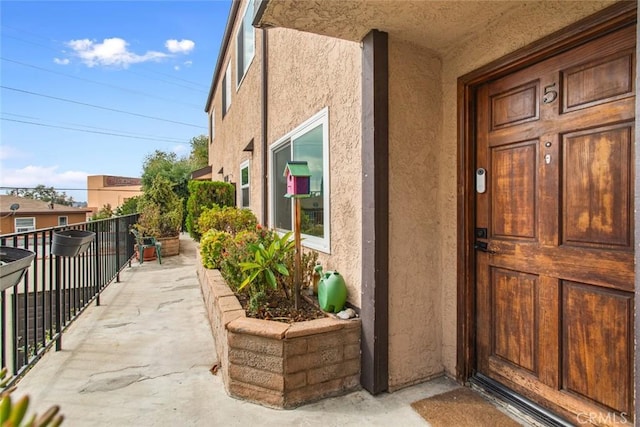 doorway to property featuring a balcony