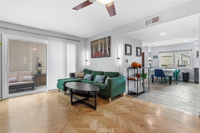 living room with light parquet floors and ceiling fan