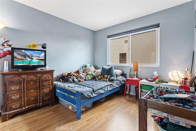 bedroom with light hardwood / wood-style flooring