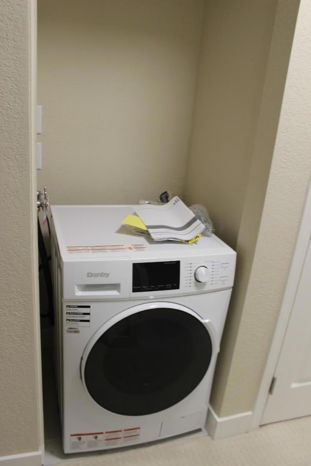 laundry area with washer / dryer