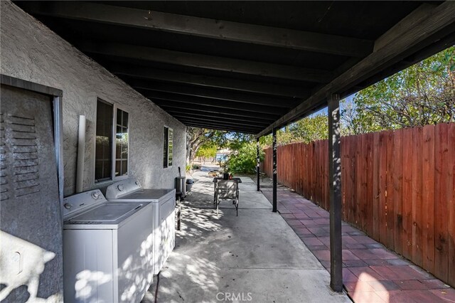 view of patio featuring washer and dryer