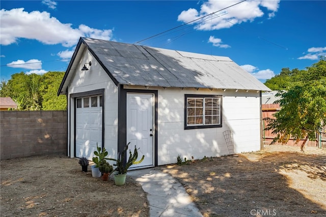 view of outbuilding with a garage