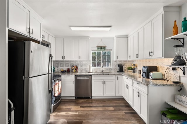 kitchen with dark wood-type flooring, white cabinetry, sink, and stainless steel appliances