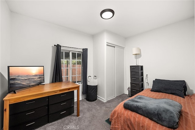 carpeted bedroom with a closet