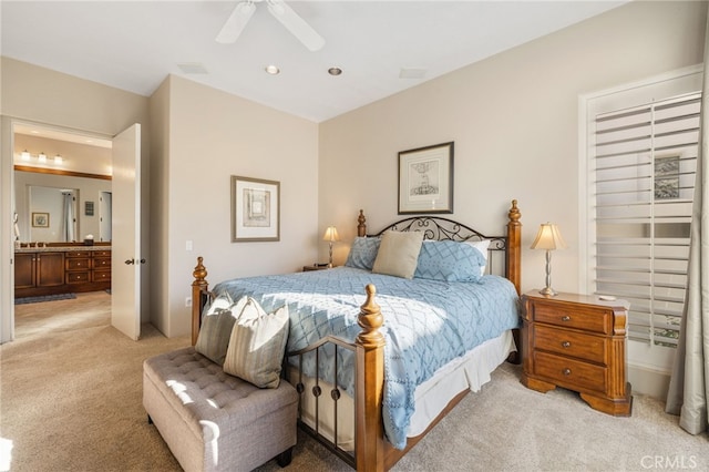 bedroom with ceiling fan and light colored carpet