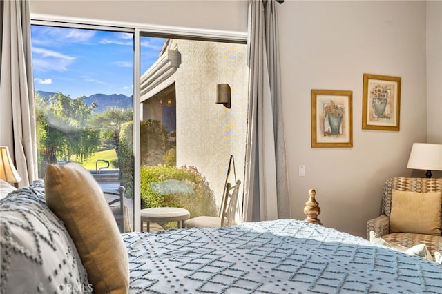 bedroom featuring a mountain view