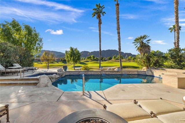 view of pool with a mountain view and a patio area